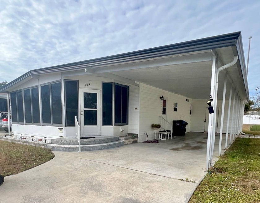Step into this welcoming 2-bedroom, 2-bath mobile home tucked - Beach Home for sale in Ellenton, Florida on Beachhouse.com