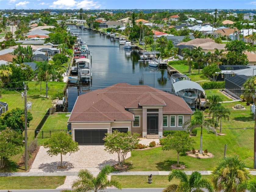 QUICK SAILBOAT ACCESS! Exceptional 3-bedroom, 2.5-bath, 3-car - Beach Home for sale in Port Charlotte, Florida on Beachhouse.com