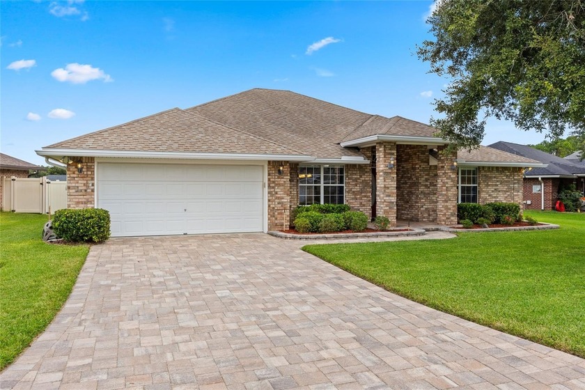 NOW REDUCED! NO CDD! Greeted by an expansive PAVERED DRIVEWAY - Beach Home for sale in Green Cove Springs, Florida on Beachhouse.com