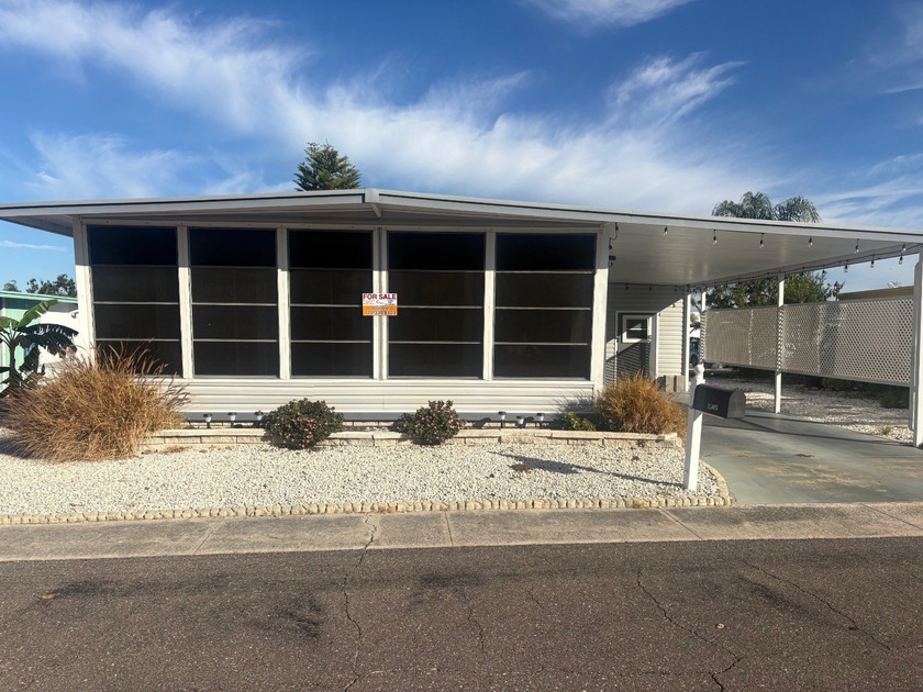 This 2 bedroom 1 1/2 bath, double-wide mobile home has been - Beach Home for sale in Dunedin, Florida on Beachhouse.com