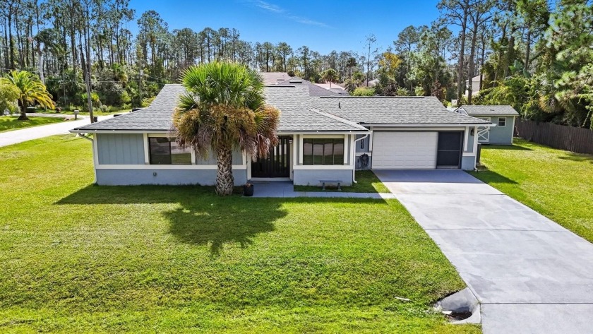 Welcome to 121 Point of Woods Dr in Palm Coast - a beautifully - Beach Home for sale in Palm Coast, Florida on Beachhouse.com