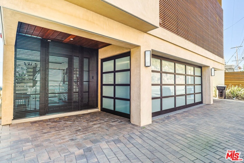 Nestled along the sun-kissed shores, this beachfront sanctuary - Beach Home for sale in Malibu, California on Beachhouse.com