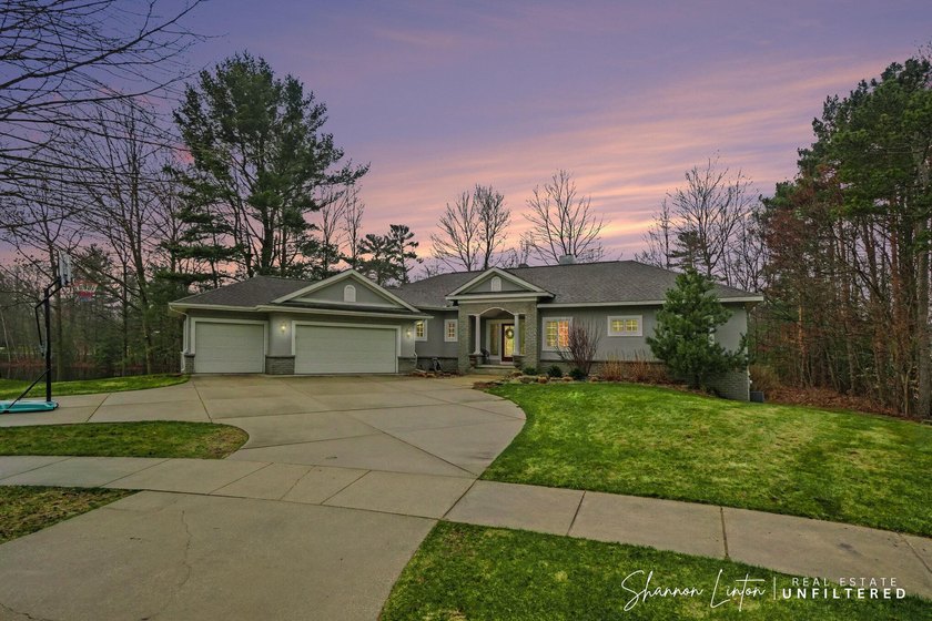 Nestled in the highly sought-after Wildwood Springs community - Beach Home for sale in Spring Lake, Michigan on Beachhouse.com