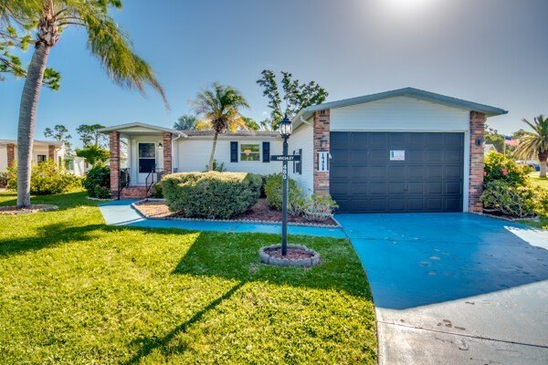 Located on a peaceful cul-de-sac in the sought-after, gated golf - Beach Home for sale in North Fort Myers, Florida on Beachhouse.com