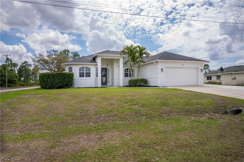 Welcome to this exceptional 4-bedroom, 2-bathroom home which is - Beach Home for sale in Lehigh Acres, Florida on Beachhouse.com