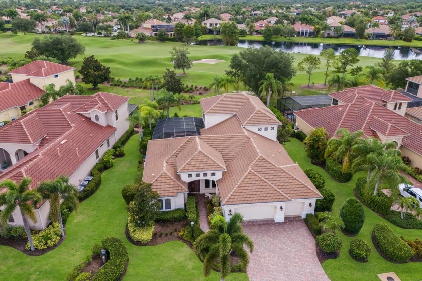 This gorgeous custom Lee Wetherington home is poised on one of - Beach Home for sale in Lakewood Ranch, Florida on Beachhouse.com