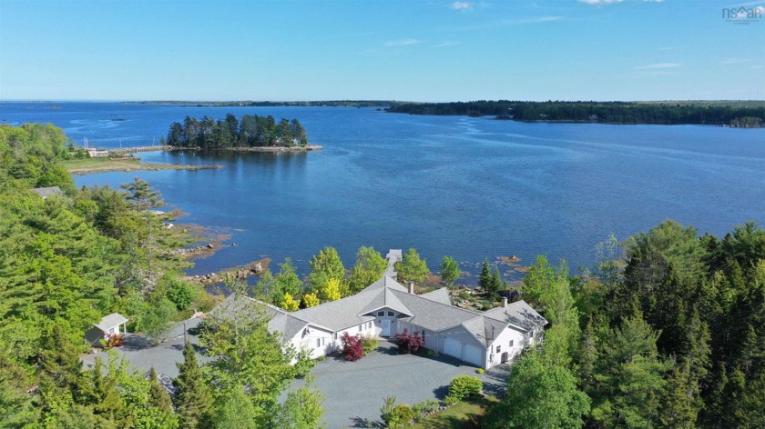 This thoughtfully designed custom bungalow, complete with guest - Beach Home for sale in East Port Medway,  on Beachhouse.com