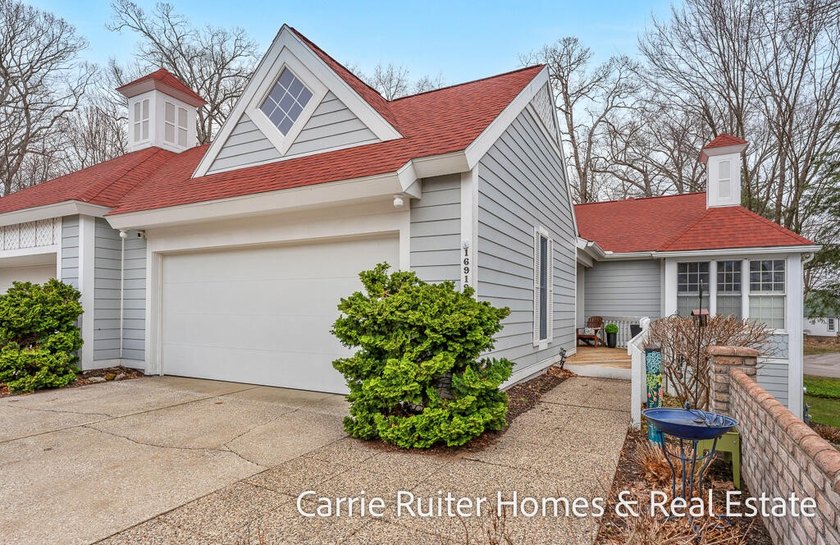 Step into elevated living with this meticulously updated luxury - Beach Condo for sale in Spring Lake, Michigan on Beachhouse.com