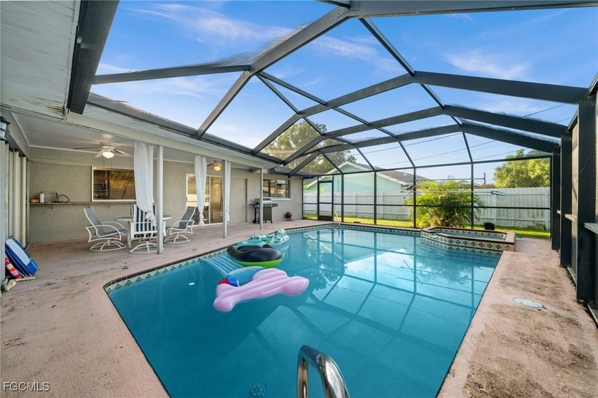 This spacious 5-bedroom, 3-bathroom pool home is located in the - Beach Home for sale in Cape Coral, Florida on Beachhouse.com