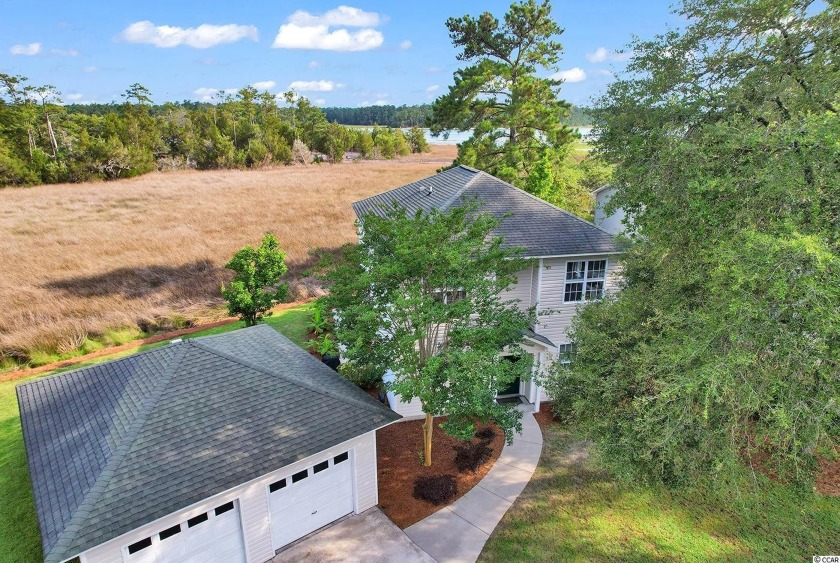 Sweeping marsh vistas along with majestic waterway views are an - Beach Home for sale in Little River, South Carolina on Beachhouse.com