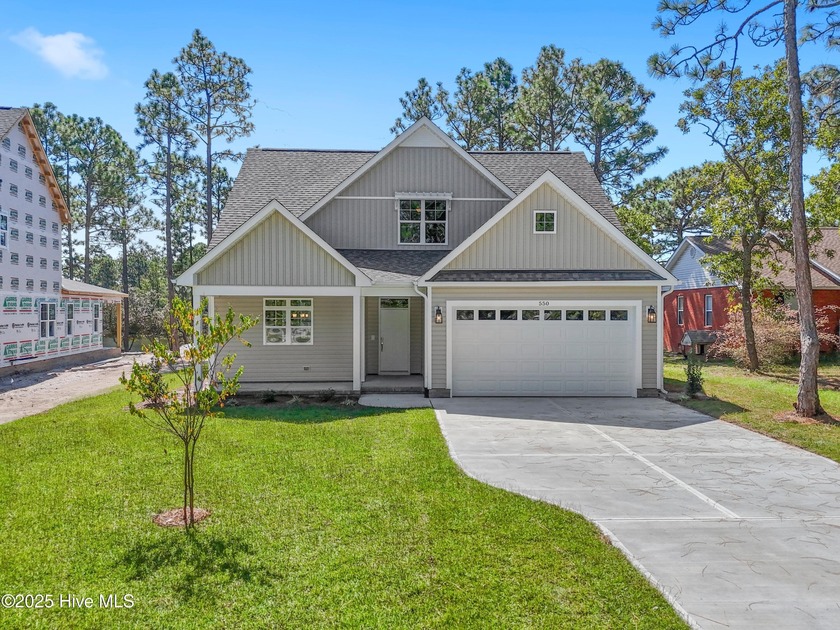 This exceptional new lakefront home by Langbeen Builders, Inc - Beach Home for sale in Southport, North Carolina on Beachhouse.com