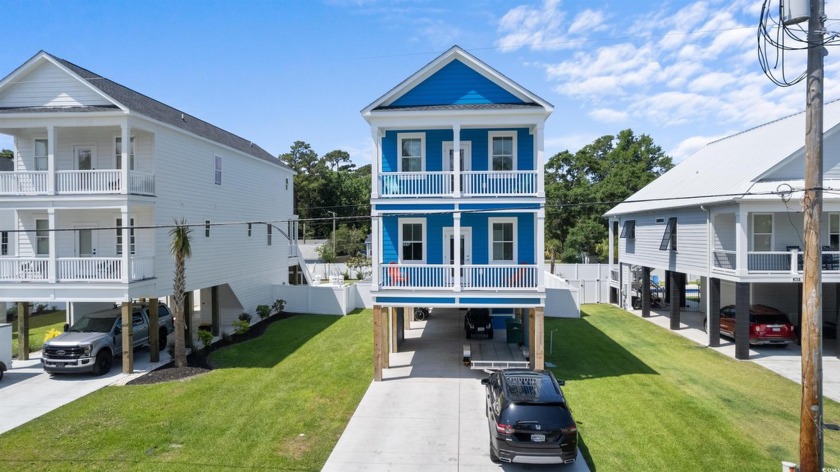 Introducing a stunning coastal retreat just a short stroll away - Beach Home for sale in Garden City Beach, South Carolina on Beachhouse.com