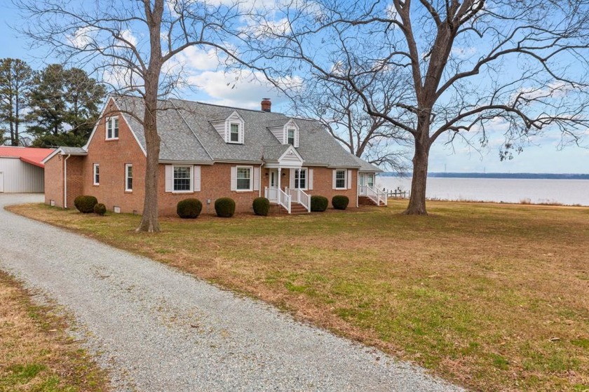 This waterfront home is situated on 3.3 acres with sand beach - Beach Home for sale in Dunnsville, Virginia on Beachhouse.com