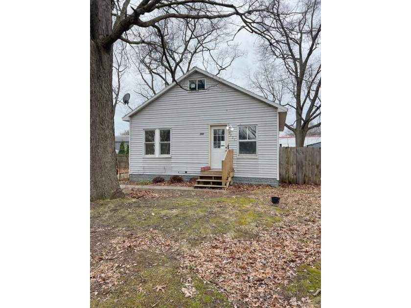 Discover this charming 2-bedroom, 1-bath bungalow in Norton - Beach Home for sale in Norton Shores, Michigan on Beachhouse.com
