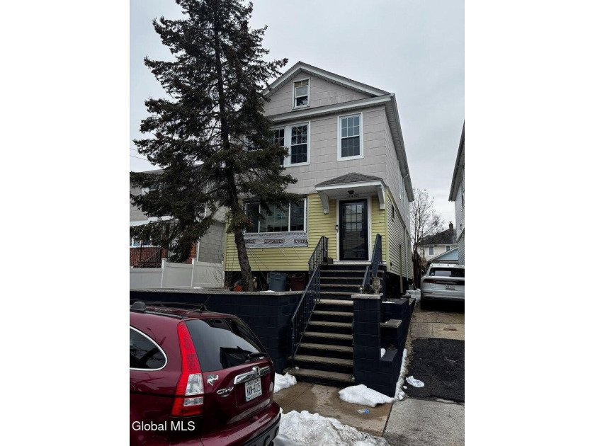 Spacious and versatile two-family home offering 6 bedrooms and 2 - Beach Home for sale in College Point, New York on Beachhouse.com