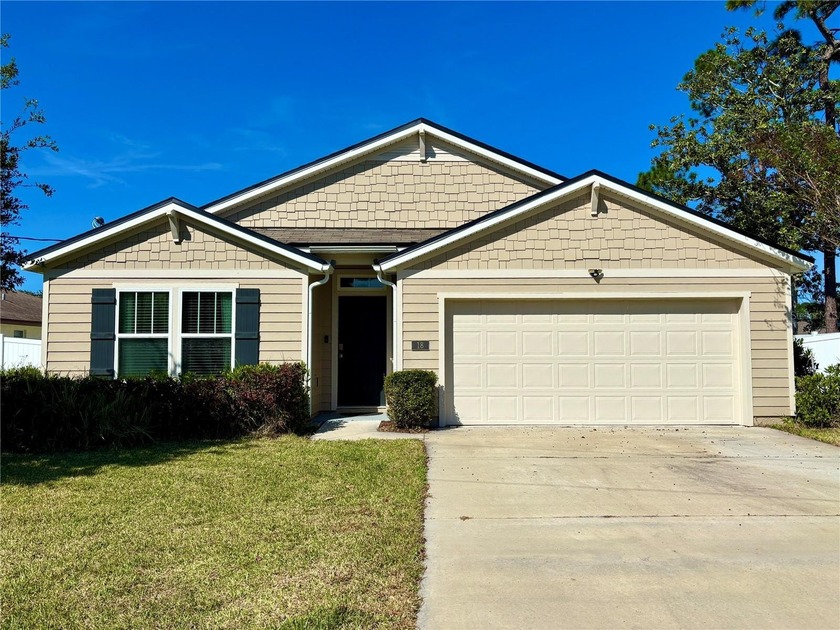 Welcome to this charming 4-bedroom, 2-bathroom home, nestled in - Beach Home for sale in Palm Coast, Florida on Beachhouse.com