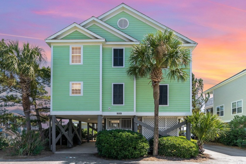 Experience coastal living at its finest in this stunning 4 - Beach Home for sale in Surfside Beach, South Carolina on Beachhouse.com