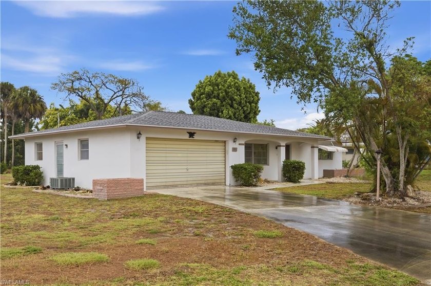 Welcome to 106 E Lake Drive, a pristine and meticulously - Beach Home for sale in Lehigh Acres, Florida on Beachhouse.com