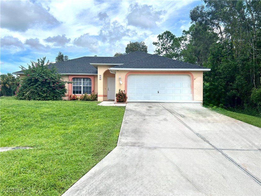 Welcome to this spacious corner-lot home in Lehigh Acres! This - Beach Home for sale in Lehigh Acres, Florida on Beachhouse.com