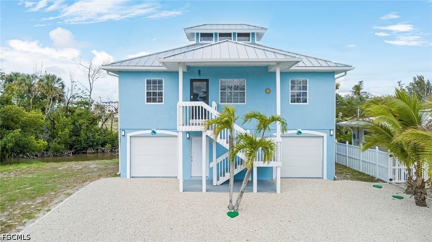 Welcome to your dream coastal getaway at 103 Tropical Shore - Beach Home for sale in Fort Myers Beach, Florida on Beachhouse.com