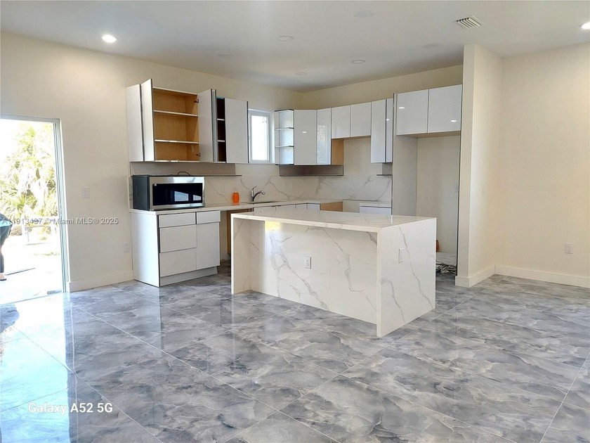 The Stunning New construction 5bed/3Bath home features a - Beach Home for sale in Port Charlotte, Florida on Beachhouse.com