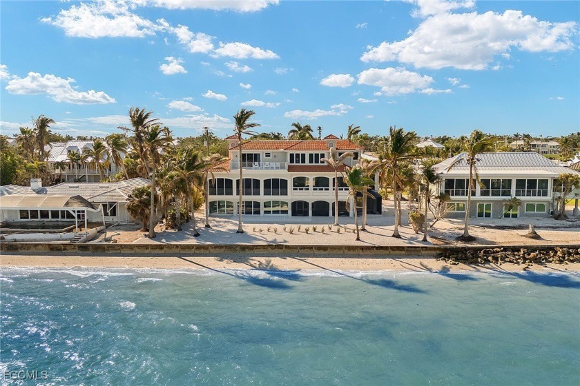 Experience the pinnacle of waterfront luxury in this - Beach Home for sale in Sanibel, Florida on Beachhouse.com