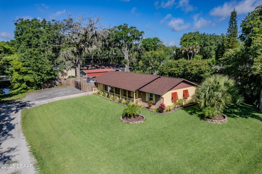 This beautifully maintained 3 bedroom, 2 bath home sits on a - Beach Home for sale in Edgewater, Florida on Beachhouse.com