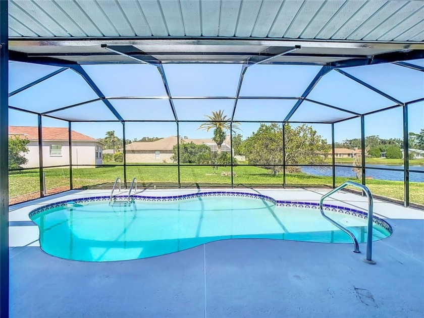 Experience luxury living in this fully remodeled home situated - Beach Home for sale in New Port Richey, Florida on Beachhouse.com