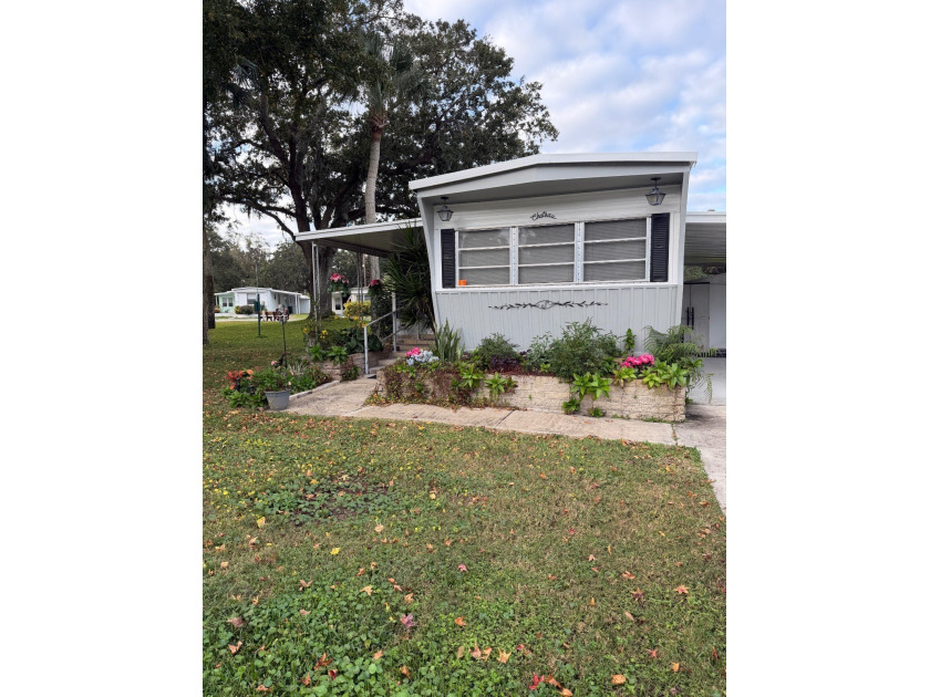 LOT RENT UNDER $600****  and mostly furnished!! Nestled in a - Beach Home for sale in Daytona Beach, Florida on Beachhouse.com