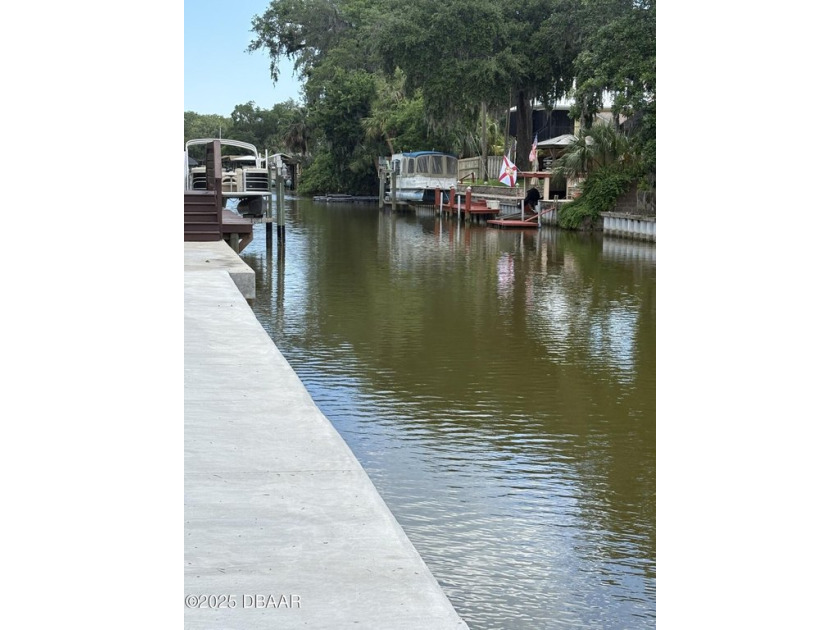 Build your Dream Home! This vacant canal front lot offers access - Beach Acreage for sale in Edgewater, Florida on Beachhouse.com