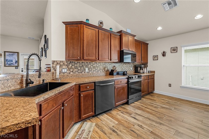 Welcome to this beautifully maintained lakefront home in the - Beach Home for sale in Punta Gorda, Florida on Beachhouse.com