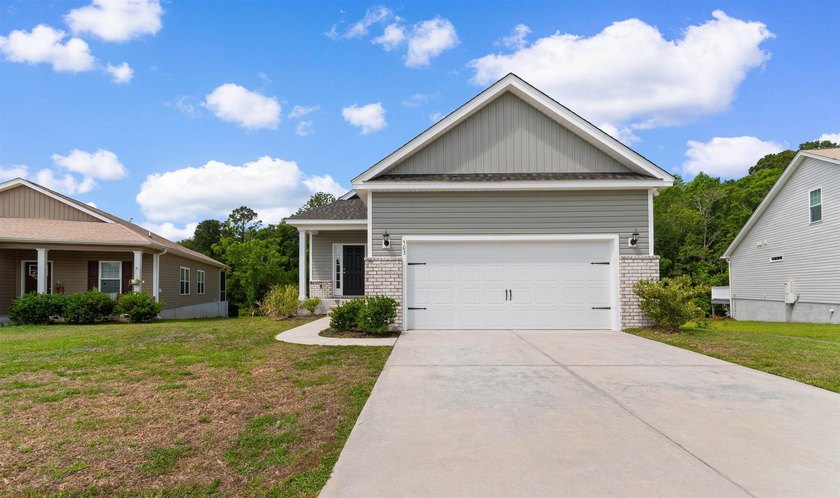 Nestled in the peaceful waterfront community of Harbor Club on - Beach Home for sale in Georgetown, South Carolina on Beachhouse.com