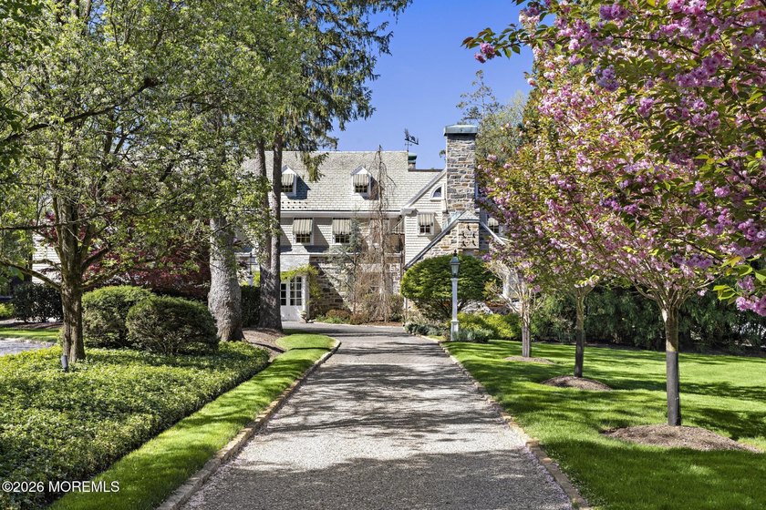 Beyond private gates, a tree-lined drive reveals Turtle Pond - Beach Home for sale in Rumson, New Jersey on Beachhouse.com