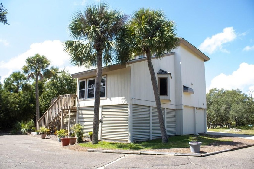 This move-in ready home is located just inside the Plantation - Beach Home for sale in St. George Island, Florida on Beachhouse.com
