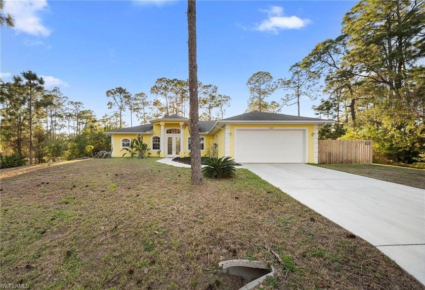 Embrace the best of both worlds with this exceptional half-acre - Beach Home for sale in Lehigh Acres, Florida on Beachhouse.com