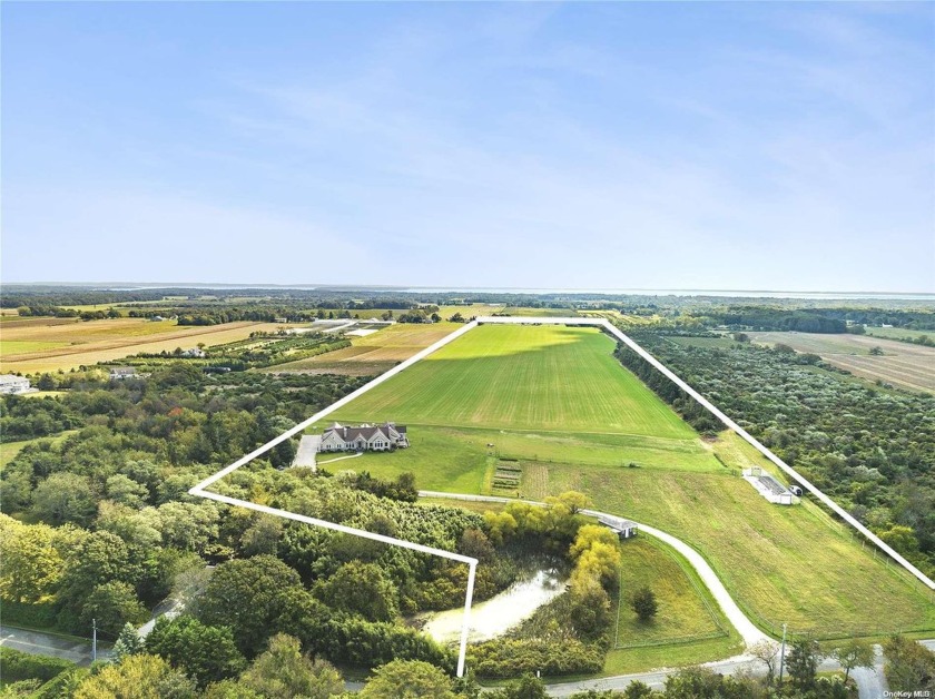 A long winding driveway rises to this spectacular 56 acre - Beach Home for sale in Mattituck, New York on Beachhouse.com