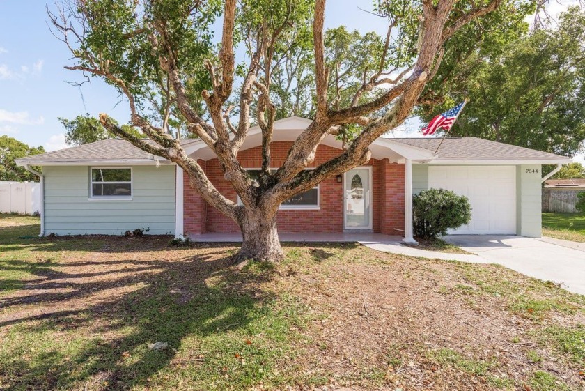 This upscale, remodeled 4-bedroom, 2-bathroom, 1-car garage - Beach Home for sale in New Port Richey, Florida on Beachhouse.com