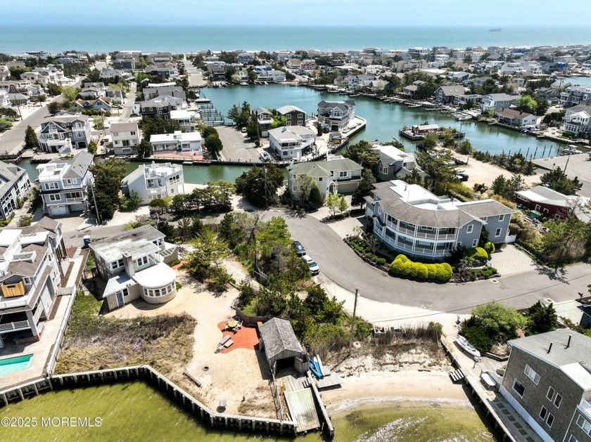 This over-sized bayfront property with approximately 110' of - Beach Home for sale in Harvey Cedars, New Jersey on Beachhouse.com