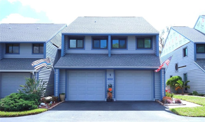 Enjoy GOLF COURSE VIEWS and an attached 2 CAR GARAGE in this - Beach Townhome/Townhouse for sale in Seminole, Florida on Beachhouse.com