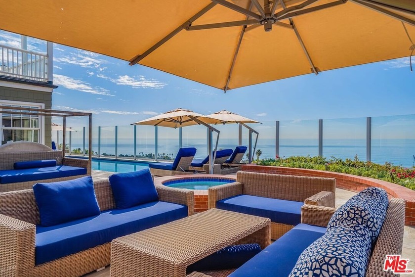 Nestled within an exclusive gated community, this exquisite Cape - Beach Home for sale in Malibu, California on Beachhouse.com