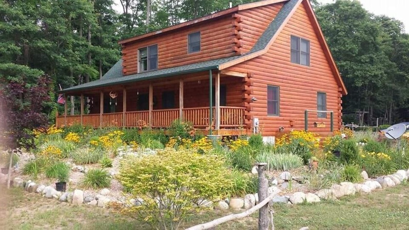 Stunning rustic log home sits on over 7 acres, beautiful and - Beach Home for sale in Covert, Michigan on Beachhouse.com