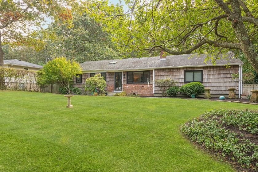 Situated on a half acre of lush property, is this three bedroom - Beach Home for sale in Southampton, New York on Beachhouse.com