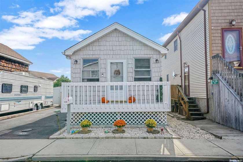 Welcome Home To This Cozy Canal-Side 1 Bedroom Home That Offers - Beach Home for sale in Bellmore, New York on Beachhouse.com