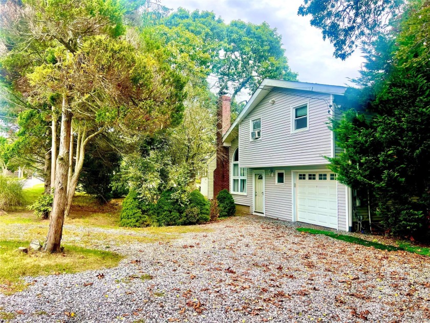 Escape to Your Hamptons Haven: Split-Level Home with Heated Pool - Beach Home for sale in Westhampton Beach, New York on Beachhouse.com