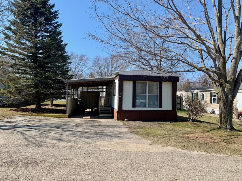 Consider a neat and tidy mobile home for year around living or a - Beach Home for sale in Ludington, Michigan on Beachhouse.com