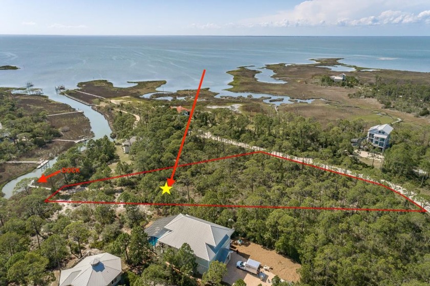 This canal front lot boasts a serene waterfront setting with - Beach Lot for sale in St. George Island, Florida on Beachhouse.com