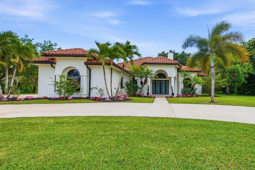 Fully renovated custom single-story estate in an exclusive gated - Beach Home for sale in West Palm Beach, Florida on Beachhouse.com