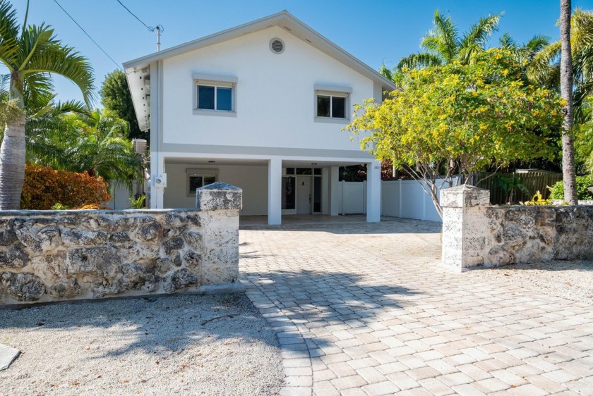 Experience the lifestyle of waterfront living in this - Beach Home for sale in Plantation Key, Florida on Beachhouse.com