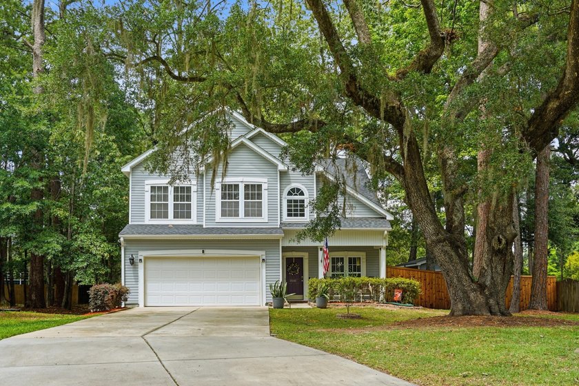 Draped in Spanish moss and framed by grand live oaks, this - Beach Home for sale in North Charleston, South Carolina on Beachhouse.com