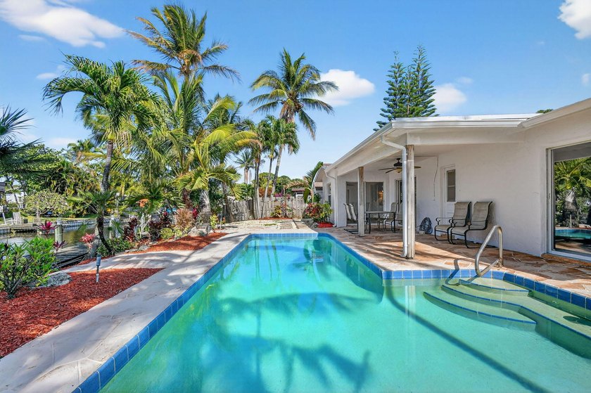 This waterfront home on the canal features a boat lift and a jet - Beach Home for sale in Boynton Beach, Florida on Beachhouse.com